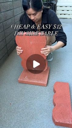 a woman standing over a red object with the words cheap and easy $ 12 diy side table