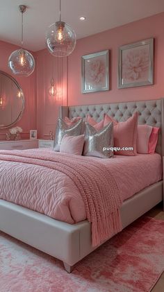 a bedroom with pink and silver decor, chandelier and bed in the corner