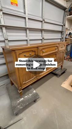 a large wooden cabinet sitting inside of a garage