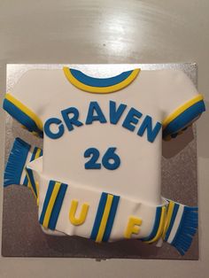 a cake shaped like a jersey with the number 26 on it