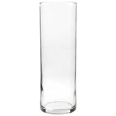 a tall glass vase sitting on top of a table