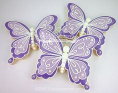 purple and white butterflies with pearls on them