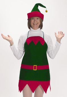 a woman dressed in an elf costume with her hands out to the side and smiling