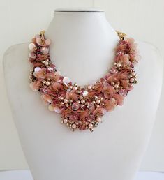 Each piece of our statement necklaces is handmade and one of a kind made in Italy. Our creations is made of high quality materials such as crystals and rhinestones. Each embroidered material is carefully hand sewn. Very glamorous and stylish. Perfect gift to someone you like. Materials Strass stone in crystal color, round sequins, White pearls,  Jeweled vintage buttons and jeweled elements in different shape and dimension. Black satin fabric backing. Aluminium chain with lobster closure. Measurements Weight approximate 200 grams. Chain lenght 25 cm - 9.84 in Circumference approximate 63 cm - 24.80 in Feel free to contact us if you have any question. Thank you so much for looking at our shop and our articles each of them, single piece. Black Satin Fabric, Collar Necklaces, Formal Jewelry, Statement Collar, Satin Noir, Statement Collar Necklace, Crystal Statement Necklace, Jewel Necklace, Coral Jewelry