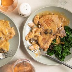 two plates filled with meat and vegetables covered in gravy