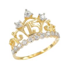 Yellow Gold 15 Años Quinceanera Crown CZ Ring Factory Direct Jewelry R1152 Celebrate the joyous transition into womanhood with our 15 Años Quinceañera Crown CZ Ring, a dazzling symbol of grace, beauty, and a memorable coming-of-age milestone. Crafted with meticulous detail, this ring features a stunning crown design adorned with Cubic Zirconia (CZ) accents, adding a touch of regal splendor to the celebration. The crown, an age-old symbol of royalty and femininity, signifies the Quinceañera's emergence into her own queendom and the responsibilities that come with it. Wearing the 15 Años Quinceañera Crown CZ Ring is a symbolic declaration of the Quinceañera's transition from girlhood to womanhood. The CZ accents add brilliance to the ring, symbolizing the radiance that comes from embracing o Quinceanera Jewelry, Quinceanera Crown, Rose Gold Crown, Black Hills Gold Jewelry, Princess Ring, Black Hills Gold, Sweet 15, Crown Ring, Morganite Engagement