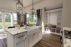 a large kitchen with white cabinets and marble counter tops