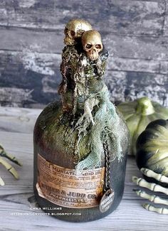 a bottle that has some kind of decoration on it's top and is decorated with fake hands