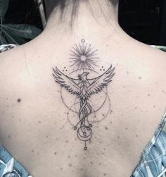 the back of a woman's neck with a tattoo on it