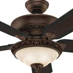 a ceiling fan with a light on it's side and two dark wood blades