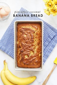 a banana bread in a pan next to some bananas