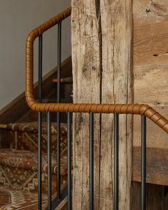 a close up of a metal and wood railing