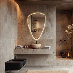 a bathroom with a sink, mirror and lights on the wall above it's counter