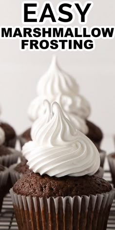 chocolate cupcakes with white frosting on top and the words easy marshmallow frosting