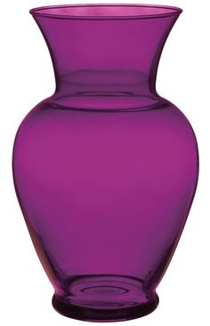 a large purple vase sitting on top of a table