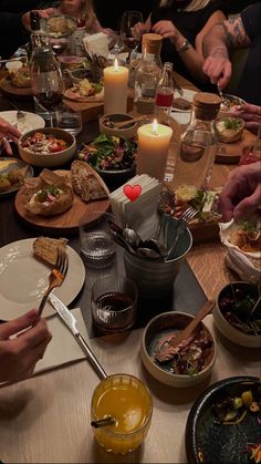 a group of people sitting around a dinner table