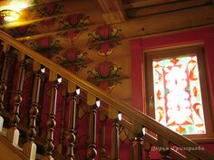 the stairs are decorated with stained glass panels