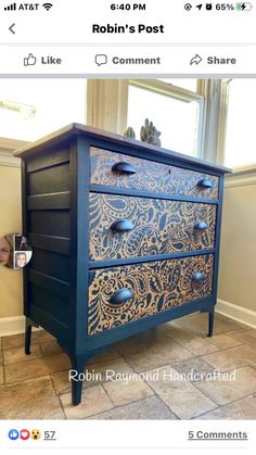 an old dresser is painted blue and gold with intricate designs on the drawers, along with other decorative items