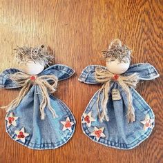 two denim angel ornaments with red and white stars on them