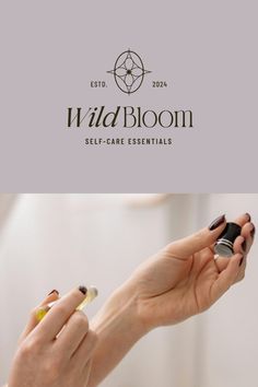 the logo for wild bloom self - care essentials is shown above two hands with nail polish