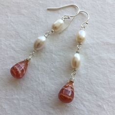 I found some SUPER COOL Rhodocrosite recently and this is one of 3 pairs of these teardrops I purchased. I have wired them with freshwater pearls on sterling silver wire on sterling silver earrings. Please choose your earwire preference as some styles are upgrades from the basic French hook style. The approximate length is 2 1/8". Your jewelry will arrive beautifully giftboxed. Homemade Pearl Earrings, Handmade Jewellery Ideas, Earrings Handmade Beaded, Sweet Alyssum, Basic French, Hardware Jewelry, Wire Jewellery, Pearl Dangle Earrings, Earring Making