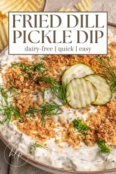 a bowl filled with yogurt, cucumber and dill pickle dip