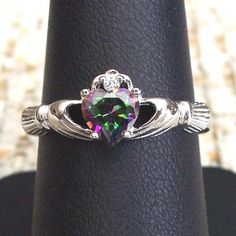 Size 6 And 10 Only. Nwot Sterling Silver Ring. This Beautiful Women's Fashion Ring Is A Claddagh Design With A Heart Shaped 5.5 (Mm), .61 Carat Simulated Mystic Rainbow Topaz. The Crown Has Round Cut Clear Cz's. It's 8.65 (Mm) Wide At Its Widest Point, Is Stamped 925 And Has A Rhodium Finish For Greater Shine And Durability. Comes From A Smoke Free Home. Silver Heart Rainbow Topaz Heart Rings, Silver Heart Jewelry Topaz Claddaugh Ring Rainbow Topaz, Claddaugh Ring, Claddagh Engagement Ring, Unique Claddagh Ring, Celtic Claddagh Ring, Sterling Silver Claddagh Ring, Geometric Diamond Ring, Rainbow Topaz