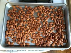 almonds on a baking sheet ready to be cooked in the oven for roasting