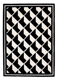 a black and white rug with an abstract design