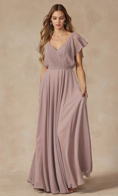 So flowy, this flutter-sleeve long formal evening gown is remarkably versatile yet affordable. Priced under $150, this beautiful a-line formal gown has a pleated deep v-neck bodice with short flutter sleeves that flow over the shoulders before trimming the deep v-back. The stylish short-sleeve long gown has banding at the waist that tops the floor-length skirt as it flows to the floor in a flattering a-line shape. Offered in misses and plus sizes, this budget-priced long formal evening gown is s Sheer Overlay Dress, Special Ocassion Dresses, Dresses Materials, Jenny Yoo Bridesmaid, Rusty Rose, Formal Bridesmaids Dresses, Formal Dresses With Sleeves, Jenny Yoo, Long Bridesmaid Dress