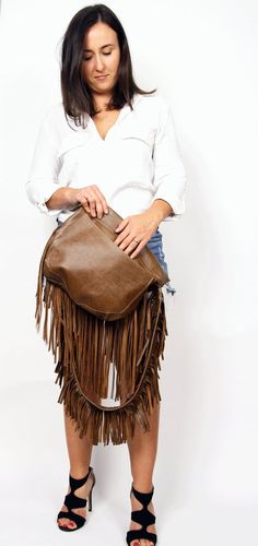 Western Fringe hobo bag - brown leather bohemian  bag, Western shoulder bag, Bohemian Women bag, Western fringe purseThis crossbody bag is the perfect size to carry your daily essentials in style! It is made from high quality leather.This leather bag is a perfect everyday bag! There is a lot of space and you can put there everything in your everyday life.* Top zipper closure* Outer slip pocket on the back* Includes internal pockets for mobile phone and other small items.Important note:The flap o Brown Fringe Bag For Everyday Use, Everyday Clutch Bag With Tassels, Travel Fringe Clutch Bag, Brown Fringe Pouch Shoulder Bag, Travel Clutch Bag With Fringe, Brown Satchel Bag With Fringe, Brown Rectangular Bag With Fringe, Brown Leather Shoulder Bag With Fringe, Brown Fringe Bags For Daily Use