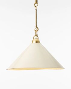 a white and gold pendant light hanging from a ceiling