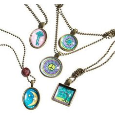 four necklaces with different designs on them