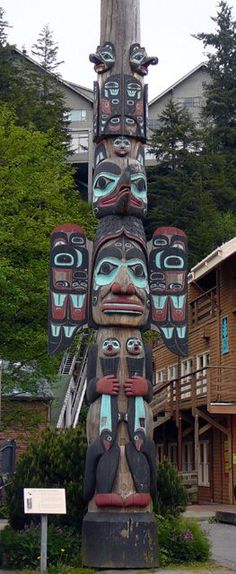 a totem pole in the middle of a town