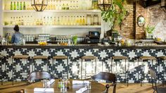 the bar is decorated with black and white tiles