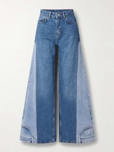 a pair of blue jeans with side panels