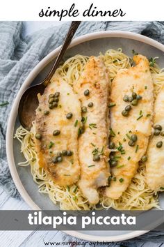 a white plate topped with chicken and pasta