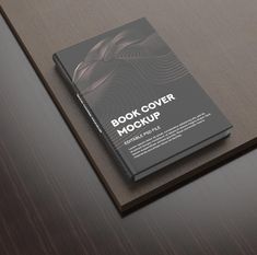 a book cover mockup sitting on top of a table