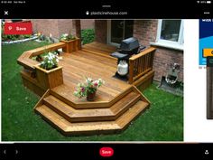 a wooden deck with potted plants on it