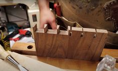 a person working with woodworking tools on a table