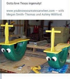 two plastic boats with faces and eyes sitting on top of a wooden table in a shop