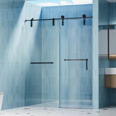 a bathroom with blue tile walls and flooring next to a white toilet under a skylight