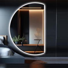 a bedroom with a bed, mirror and table in the corner that is lit up