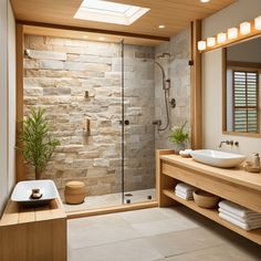 a bathroom with a sink, mirror and shower in it's center area is shown