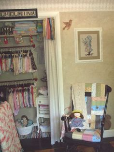 a baby's room with a rocking chair and closet