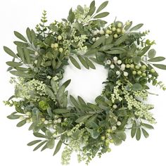 a wreath with green leaves and white berries