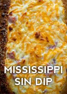 a close up of a pizza on a pan with the words mississippi sun dip above it