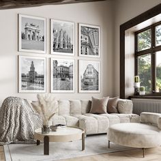 a living room filled with furniture and pictures on the wall above it's windows