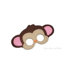 a monkey mask with pink ears on it's face and eyes are made out of felt