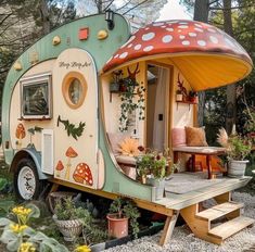 an old camper converted into a tiny house with mushrooms on the roof and windows